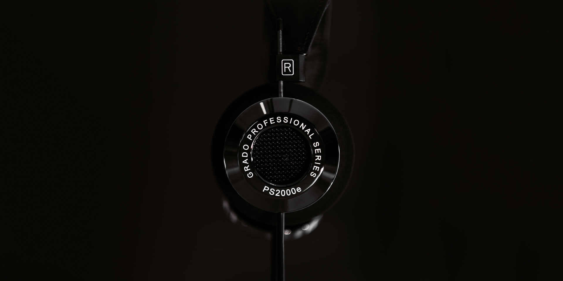 Photo of PS2000e headphones from the side on a black background