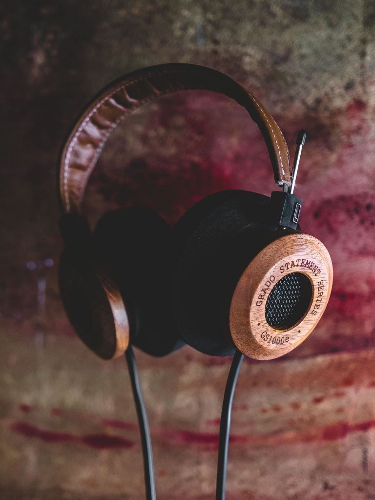 Photo of gs1000e headphones resting on a table with smeared red paint on it