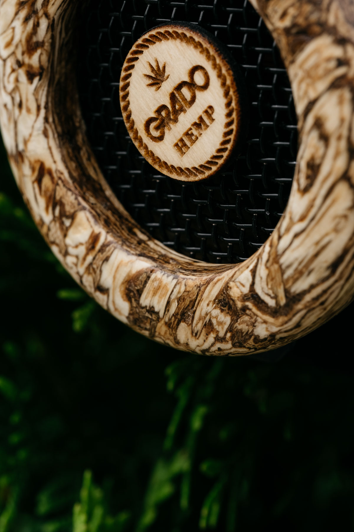 Closeup photo of The Hemp Headphones showing in front of greenery